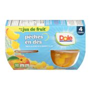 Coupes de pêches en dés dans du jus de fruit