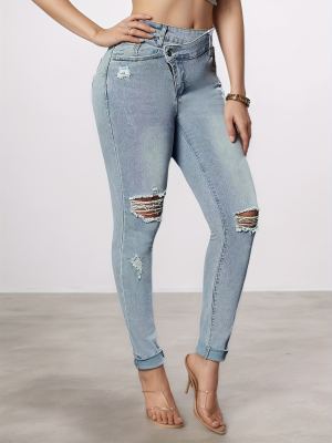 Jean femme délavé, coupe moulante, ceinture incluse