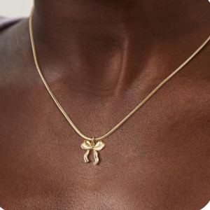 Collier nœud chaîne clavicule doré femme